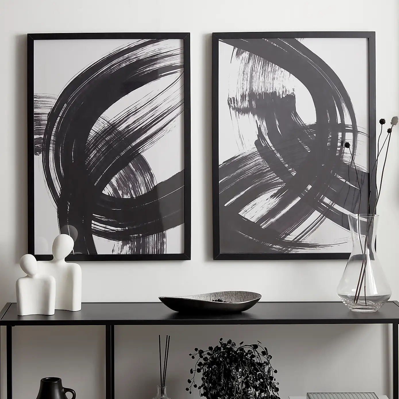 black frames with black and white abstract artwork
