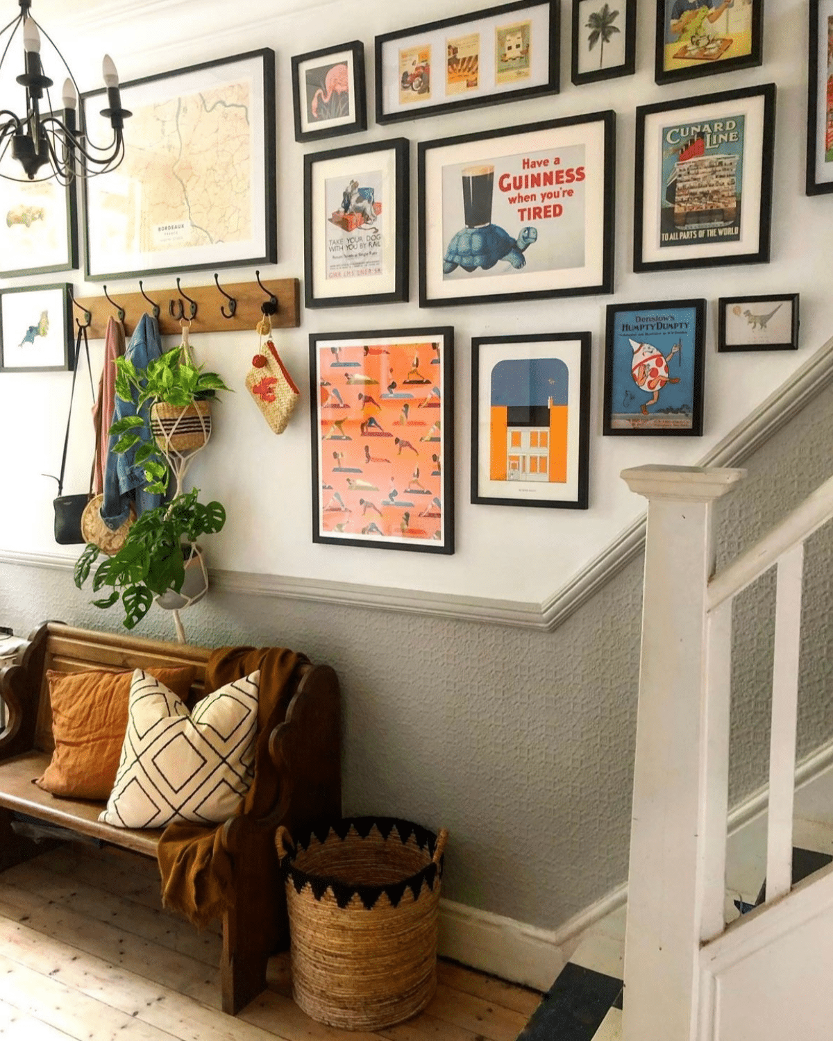 grey dado rail hallway with black framed gallery wall