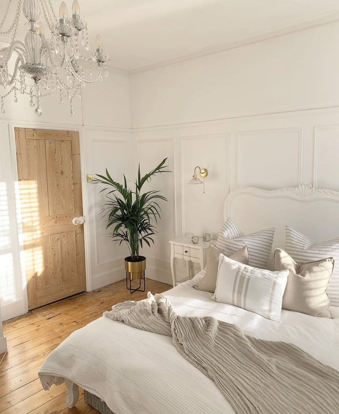White bedroom with plants